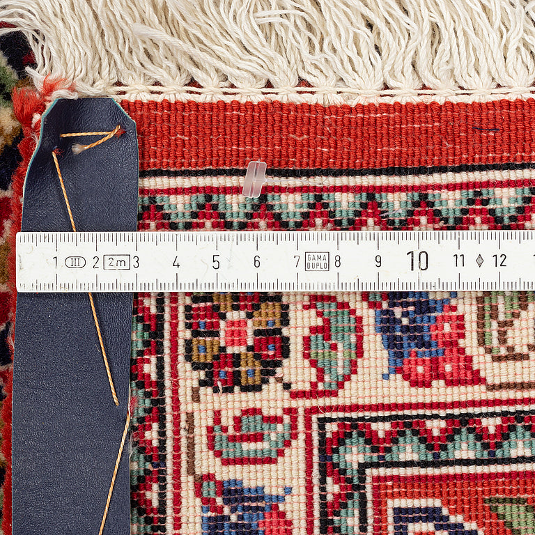 A high quality Persian hand-knotted atelier carpet made in the Ghom district. Size ca 138 x 195 cm.