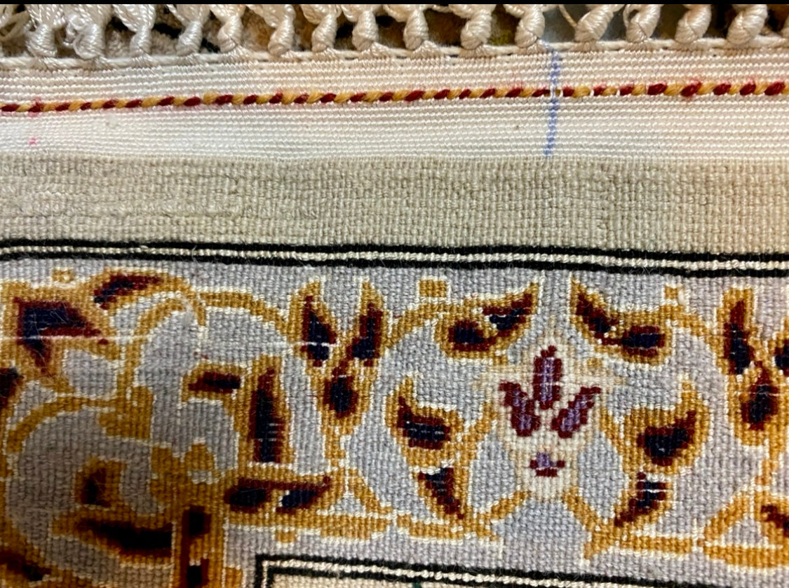 A high quality Persian hand-knotted atelier Isfahan carpet with 40% pure silk inlays with a hunting motiv. Size 130x170. Signed!