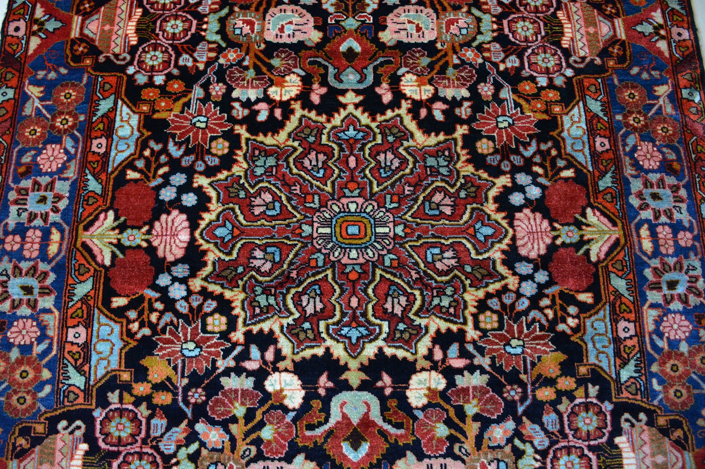 Semiantique Persian handknotted village rug from the Nahavand district. Size 128 x 224 cm.