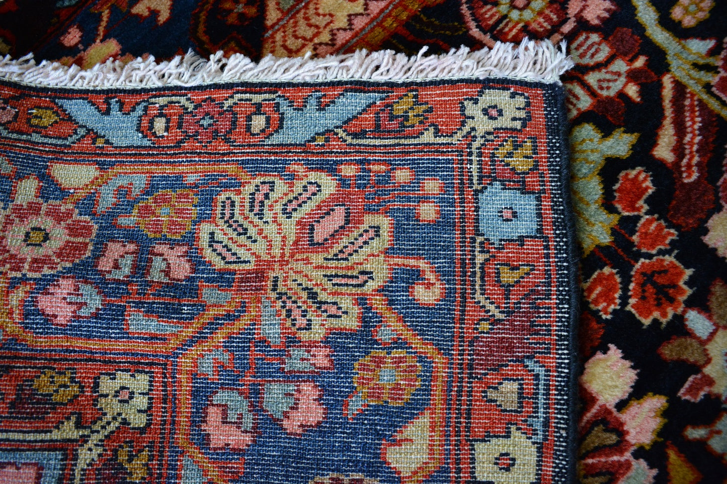 Semiantique Persian handknotted village rug from the Nahavand district. Size 128 x 224 cm.