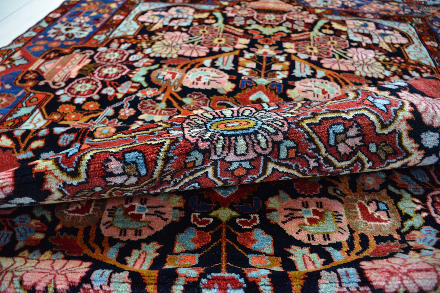 Semiantique Persian handknotted village rug from the Nahavand district. Size 128 x 224 cm.