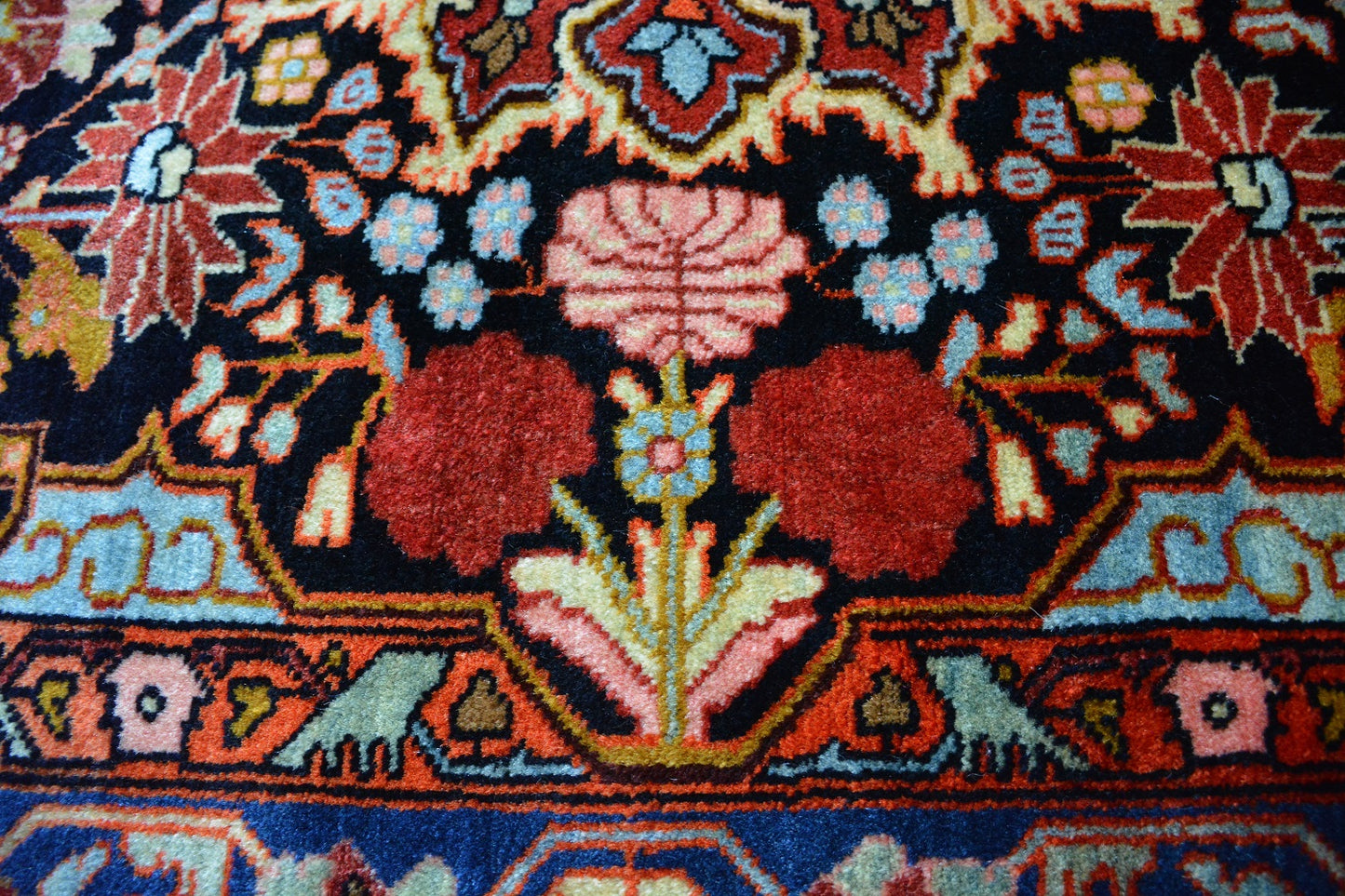 Semiantique Persian handknotted village rug from the Nahavand district. Size 128 x 224 cm.