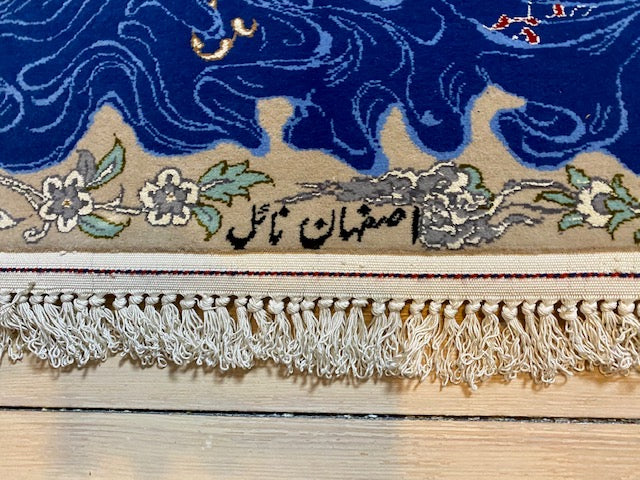 Isfahan handmade of pure kork wool, with warp of silk, and inlays of silk. Size ca 80 x 130 cm.